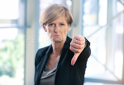 Buy stock photo Portrait, thumbs down and business woman with hand, opinion or fail sign for problem in office. Negative, gesture and dislike for vote, feedback or review of mature CEO with sad face for wrong emoji