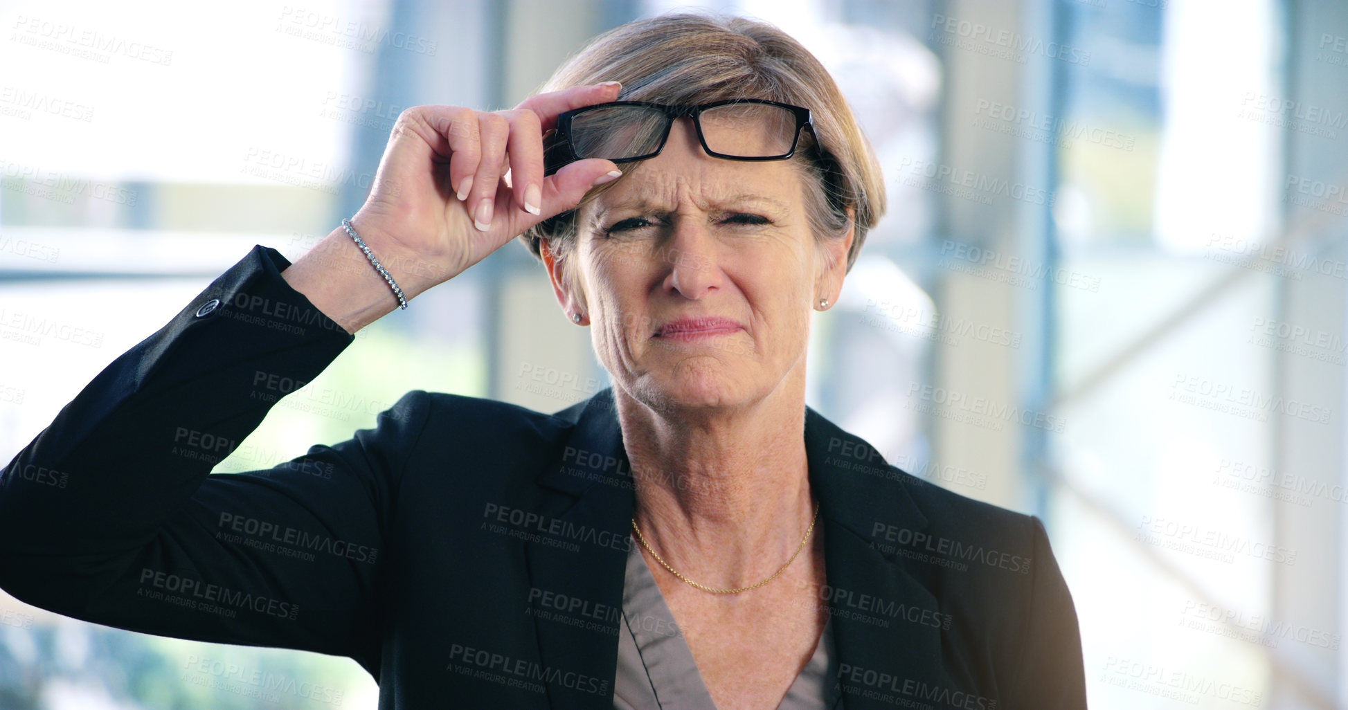 Buy stock photo Portrait, doubt and question with a business woman looking confused while standing in her office at work. Corporate, management and leadership with a senior female CEO frowning while lifting glasses