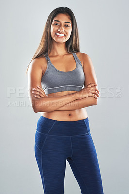 Buy stock photo Cropped studio portrait of an attractive young woman posing against a gray background