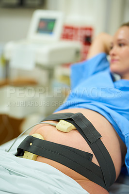 Buy stock photo Shot of a young pregnant woman lying back in her hospital bed on her due date