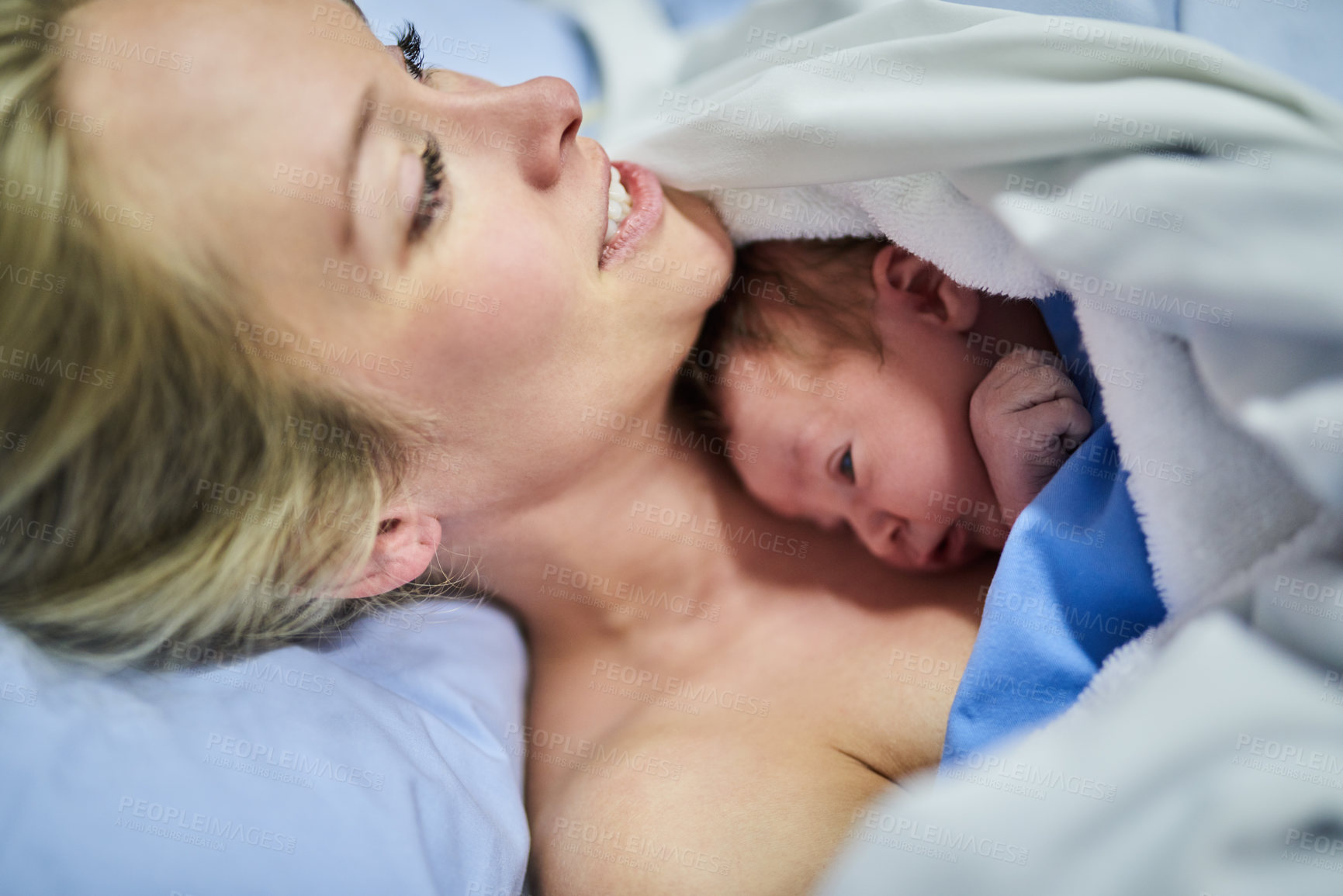 Buy stock photo Shot of a beautiful young mother lying in bed with her newly born baby girl in the hospital