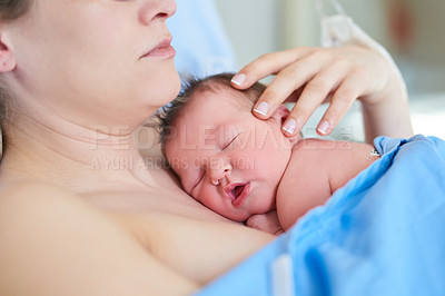 Buy stock photo Shot of an adorable newly born baby girl sleeping on her mother's chest at hospital