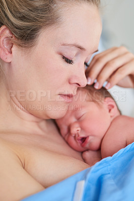 Buy stock photo Shot of a beautiful young mother and her newly born baby girl sleeping in a hospital bed together