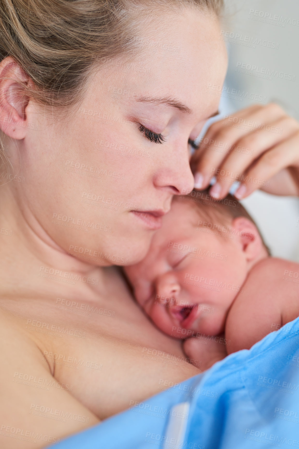 Buy stock photo Shot of a beautiful young mother and her newly born baby girl sleeping in a hospital bed together