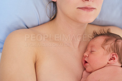 Buy stock photo Shot of an adorable newly born baby girl sleeping on her mother's chest at the hospital