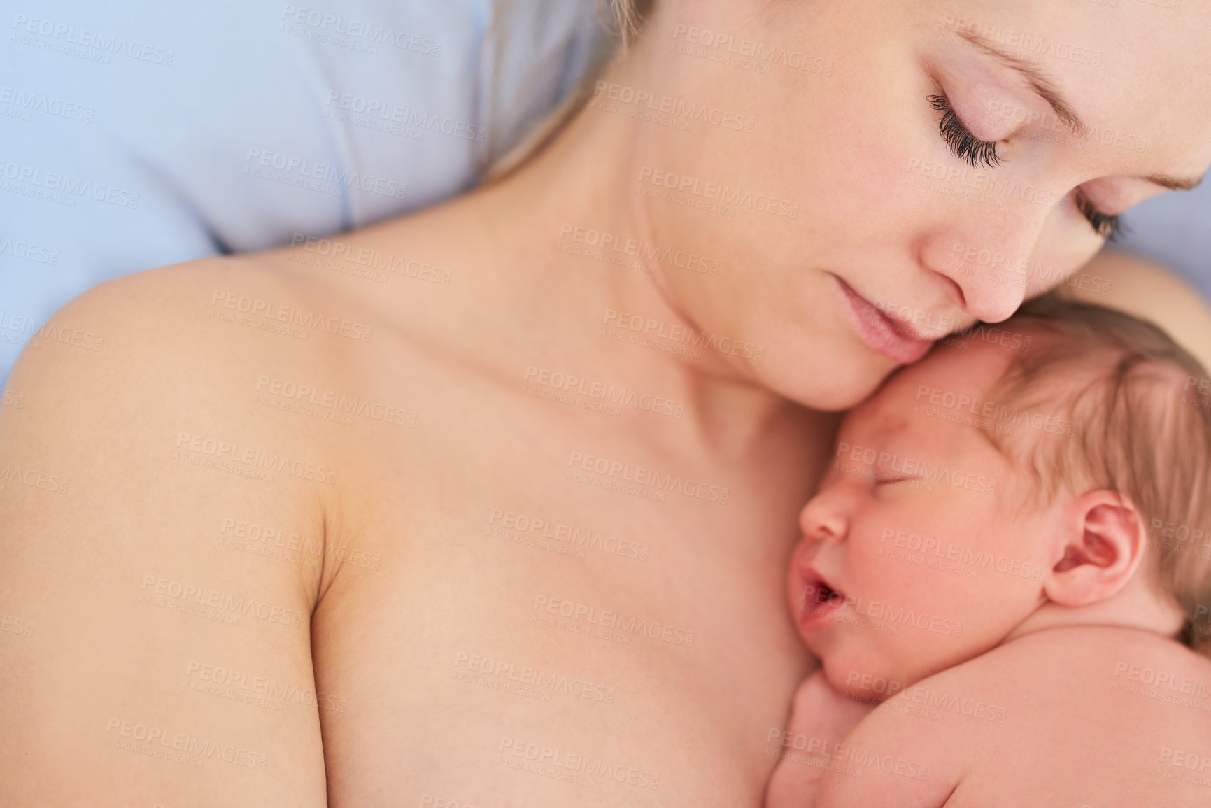 Buy stock photo Shot of a beautiful young mother and her newly born baby girl sleeping in a hospital bed together