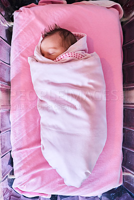 Buy stock photo High angle shot of a newly born baby girl wrapped in a blanket in the hospital