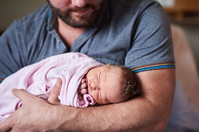 Buy stock photo Shot of an adorable infant girl sleeping in her father's arms in hospital