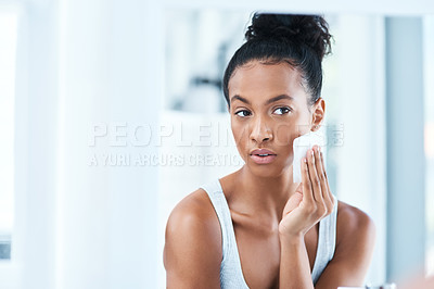 Buy stock photo Skin care, black woman with cotton wipe on face and makeup cleaning with luxury cosmetic product in bathroom. Dermatology, cosmetics and beauty facial, African model with cleansing pad and mock up.