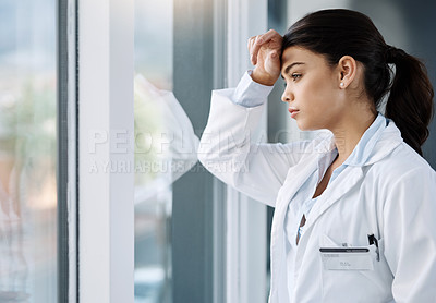 Buy stock photo Thinking, stress and doctor by window in hospital with worry, anxiety and tired with headache in clinic. Healthcare, mental health and woman health worker with stressed out, depression and burnout