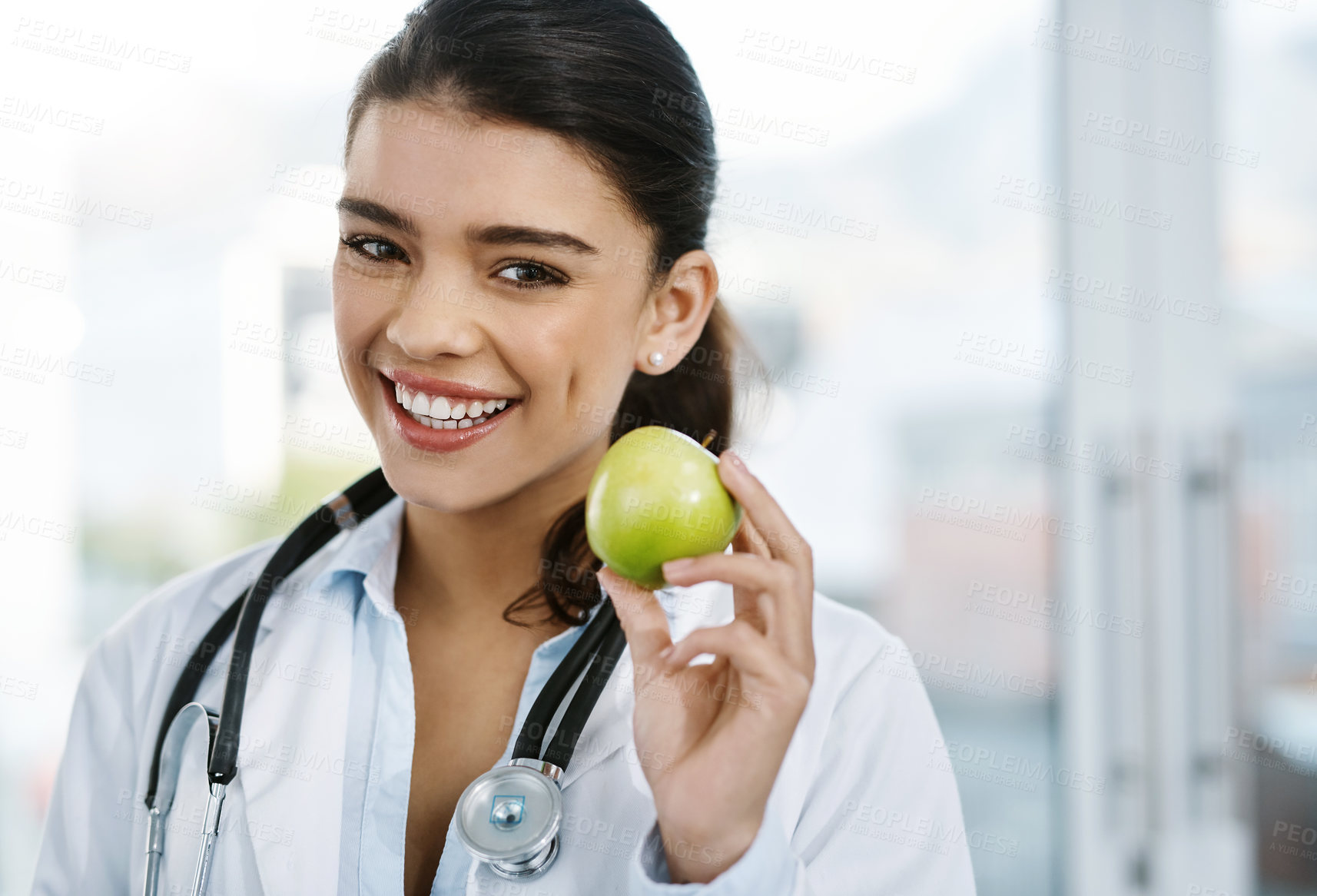 Buy stock photo Portrait, doctor and happy woman with apple for healthy diet, nutrition or wellness. Face, nutritionist or medical professional with fruit for vitamin c, healthcare or natural food for vegan benefits