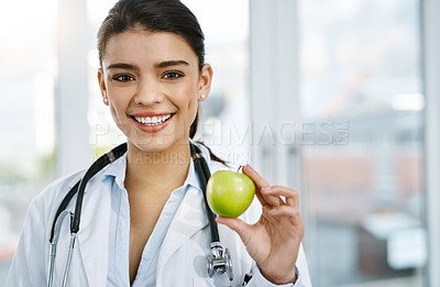 Buy stock photo Doctor, portrait and smile of woman with apple for nutrition, healthy diet or wellness. Face, nutritionist and medical professional with fruit for vitamin c, healthcare and food for vegan benefits.