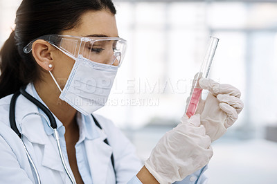 Buy stock photo Shot of a young scientist working in a lab