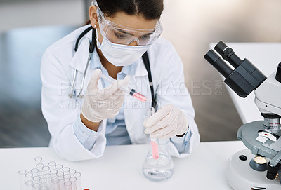 Buy stock photo Shot of a young scientist working in a lab