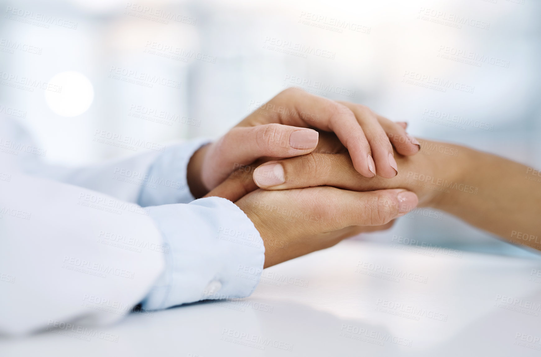 Buy stock photo Closeup shot of a doctor holding a patient's hand in comfort