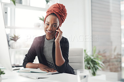 Buy stock photo Cropped portrait of an attractive young businesswoman making a phonecall while sitting at her desk in the office