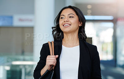 Buy stock photo Cropped shot of an attractive young businesswoman walking through a modern office