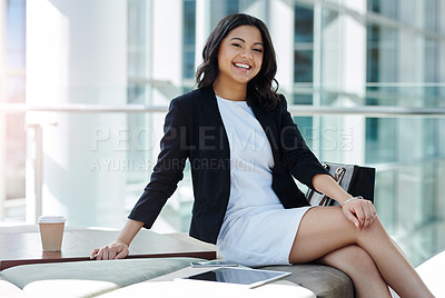 Buy stock photo Cropped portrait of an attractive young businesswoman smiling while sitting in a waiting room