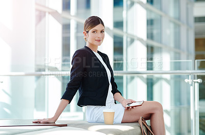 Buy stock photo Cropped portrait of an attractive young businesswoman using a smartphone while sitting in a waiting room