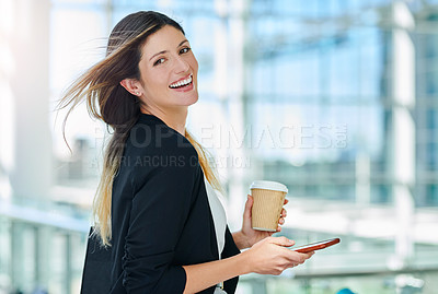 Buy stock photo Cropped portrait of an attractive young businesswoman smiling while walking through a modern office