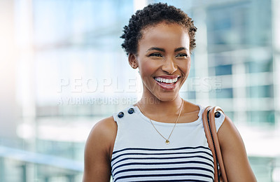 Buy stock photo Cropped shot of an attractive young businesswoman smiling while standing in a modern office