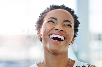 Buy stock photo Cropped shot of an attractive young businesswoman laughing  while standing in a modern office