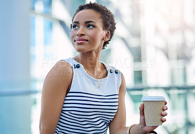 Buy stock photo Cropped shot of an attractive young businesswoman looking thoughtful while sitting in a modern workplace