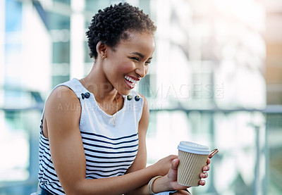 Buy stock photo Cropped shot of an attractive young businesswoman laughing while sitting in a modern workplace