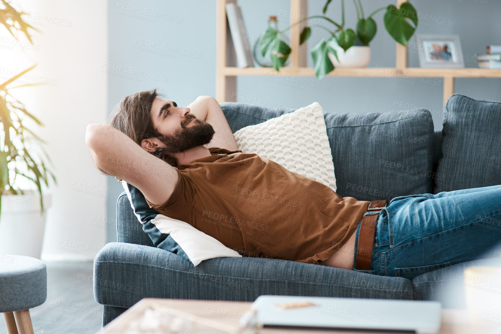 Buy stock photo Relax, thinking and wellness with man on sofa in living room of home for break, daydreaming or rest. Happy, smile and vision with person in apartment for chilling on morning or weekend time off