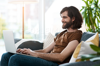 Buy stock photo Laptop, happy and man in home typing email for connectivity, contact and networking for startup business, Computer, communication and male freelance copywriter relax in living room with remote work.