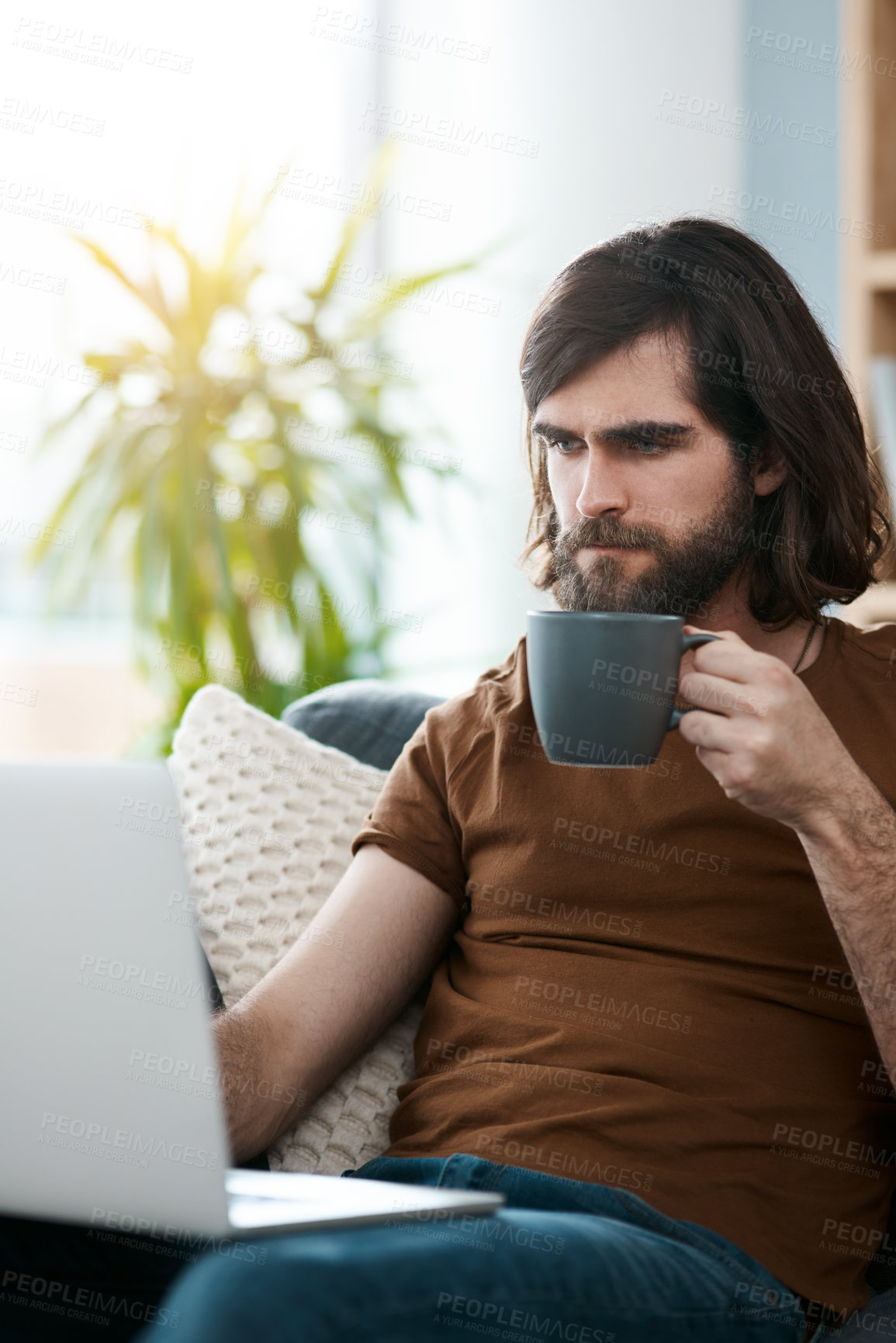 Buy stock photo Man, coffee and laptop on couch in house for website template review, testing sample webpage or online research. Remote work, web designer or freelancer on sofa with technology for digital retouching