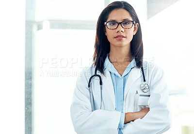 Buy stock photo Portrait of a confident young doctor working in a modern hospital