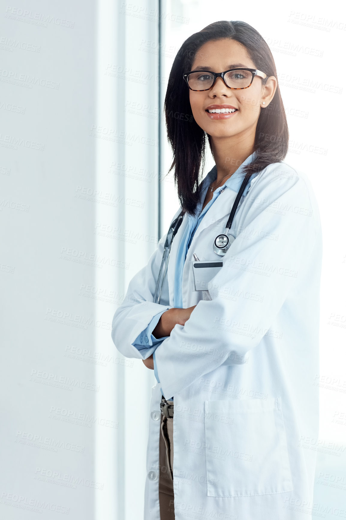 Buy stock photo Portrait of a confident young doctor working in a modern hospital