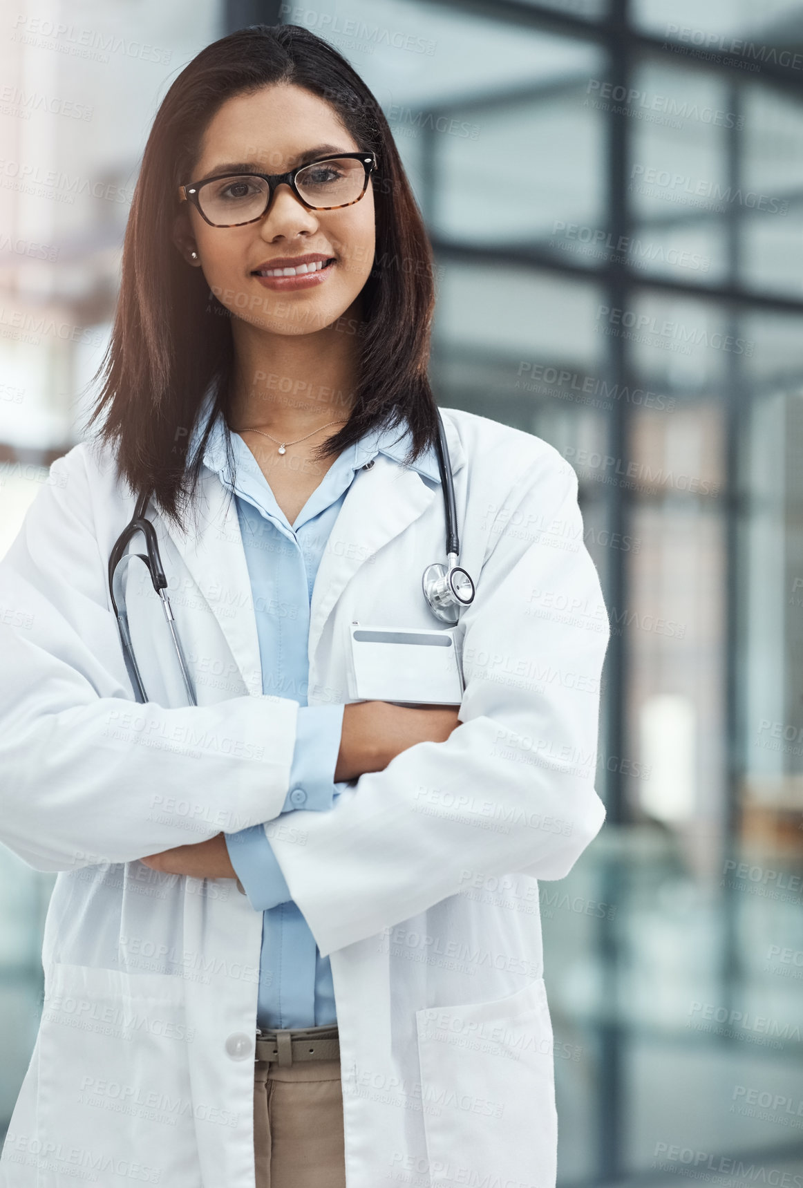 Buy stock photo Portrait of a confident young doctor working in a modern hospital