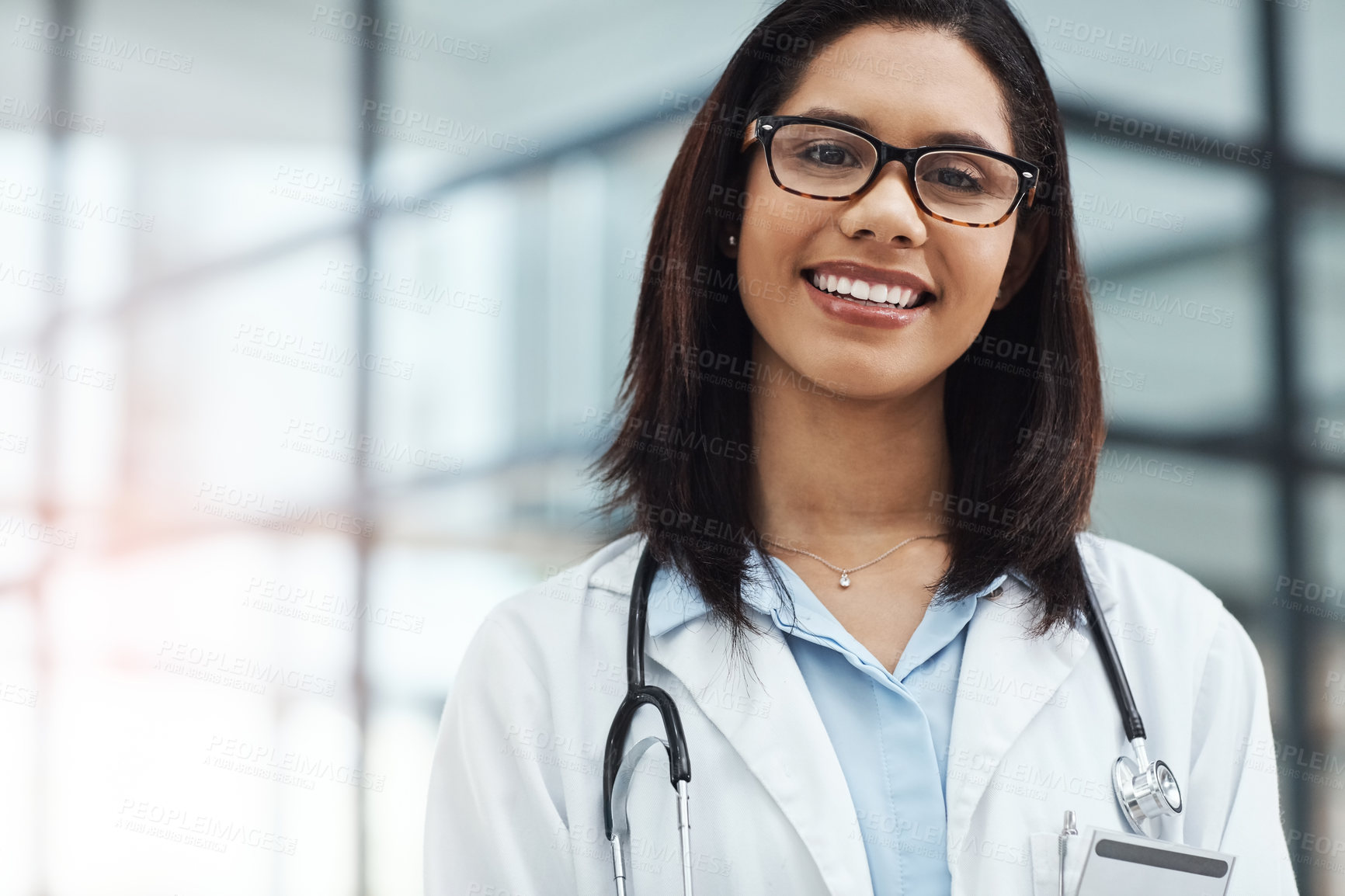 Buy stock photo Portrait of a confident young doctor working in a modern hospital