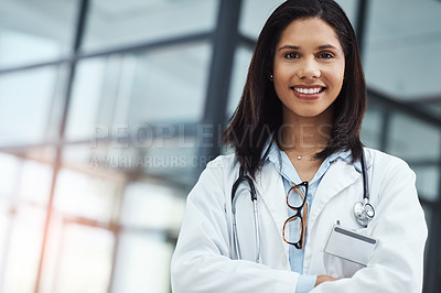 Buy stock photo Portrait of a confident young doctor working in a modern hospital