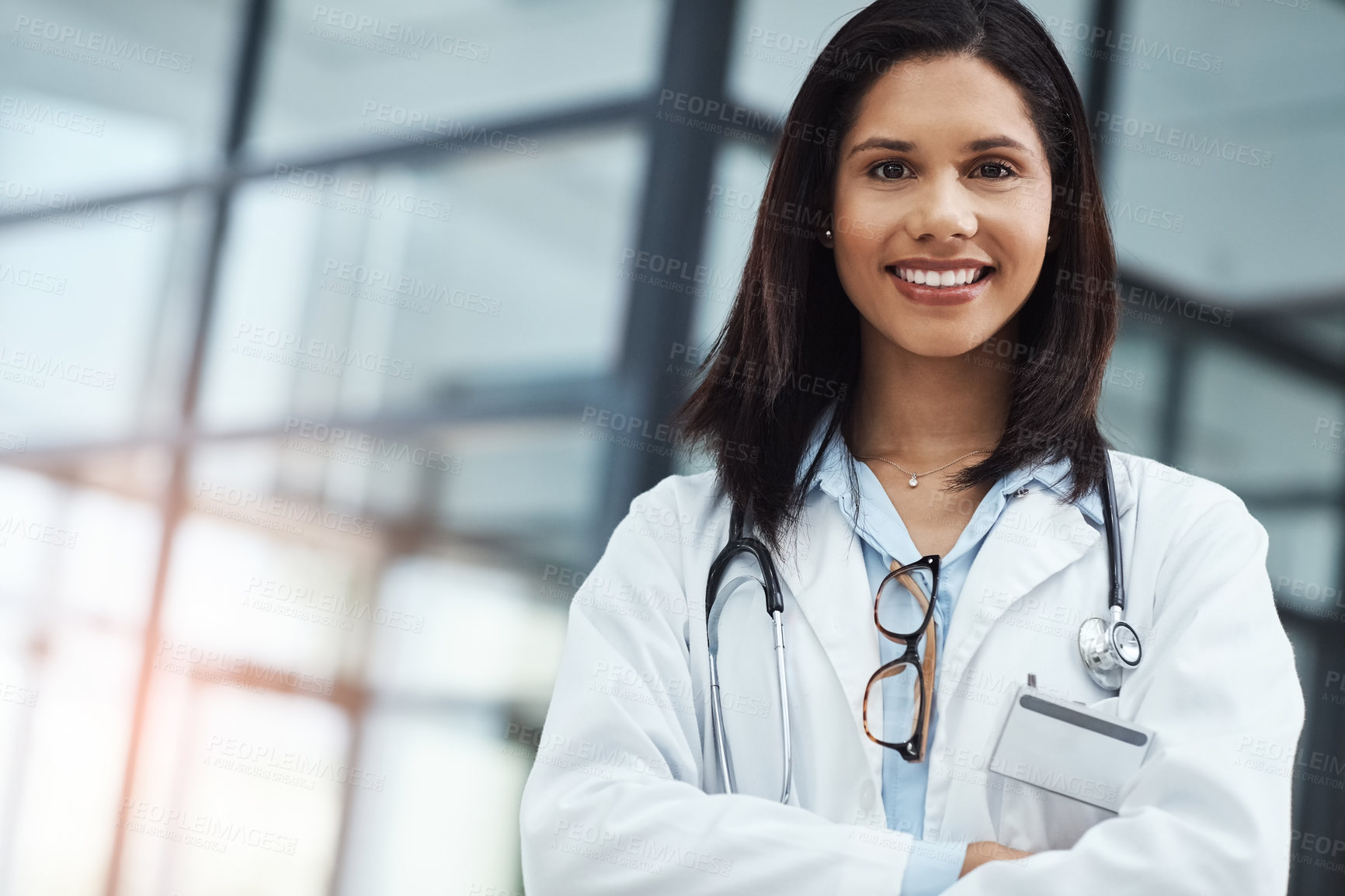 Buy stock photo Portrait of a confident young doctor working in a modern hospital