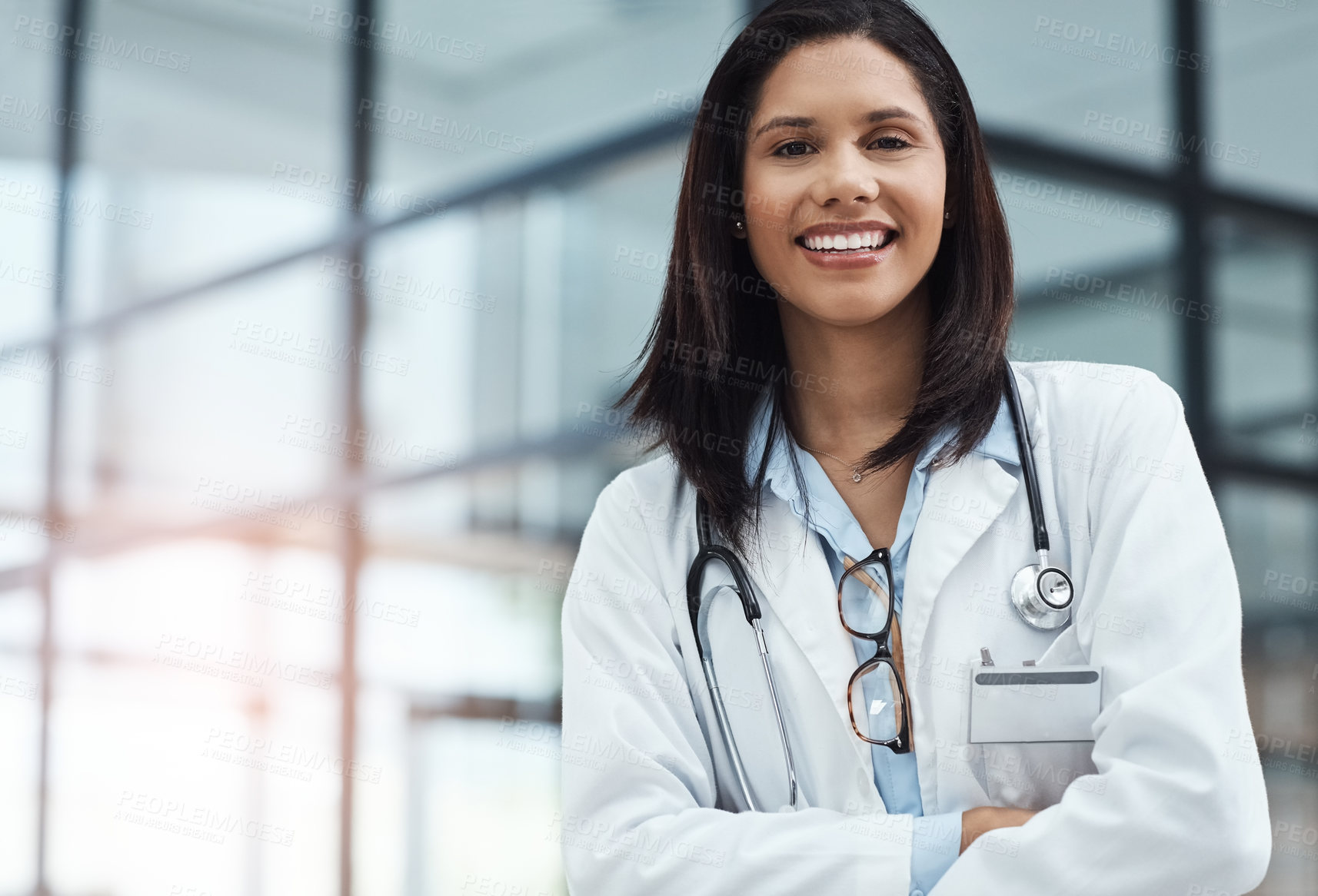 Buy stock photo Portrait of a confident young doctor working in a modern hospital