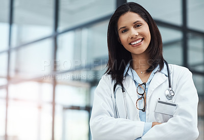 Buy stock photo Portrait of a confident young doctor working in a modern hospital