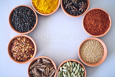 Buy stock photo Spices, organic and selection of herbs seasoning on studio background for cooking and top view mockup. Variety, condiments bowl and flavor ingredients with tumeric, masala powder and ground pepper