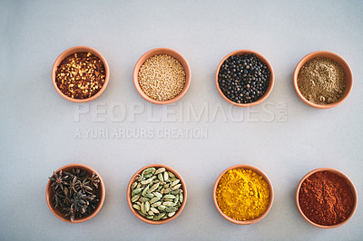 Buy stock photo Spices, organic and variety of herbs seasoning on studio background for cooking and top view mockup. Selection, condiments bowl and flavor ingredients with cinnamon, masala powder and ground pepper