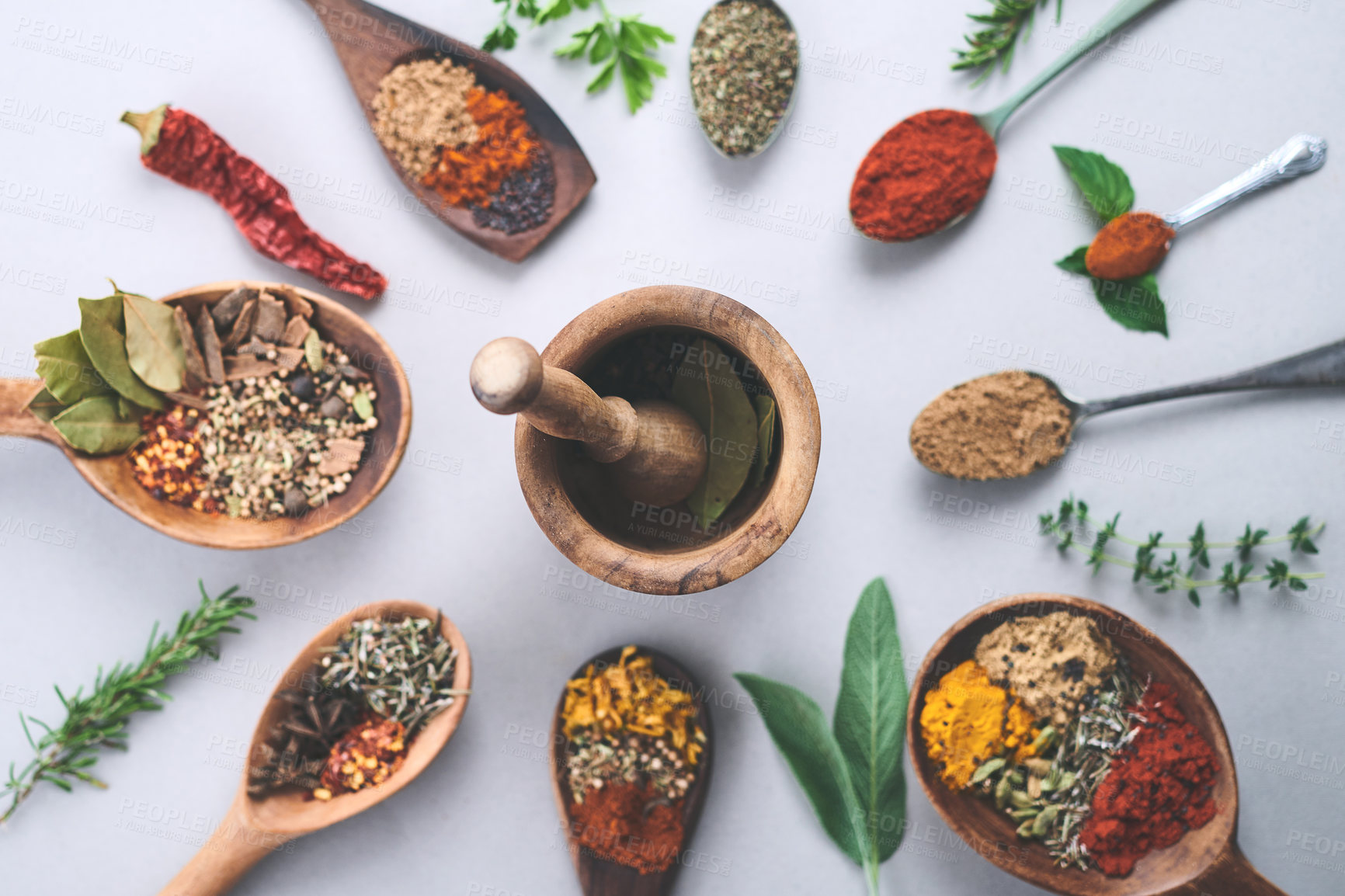 Buy stock photo Spices, ingredients and arrangement of herbs seasoning on studio background for cooking or top view. Utensils, organic condiments or flavor additives with curry leaves, masala powder or ground pepper