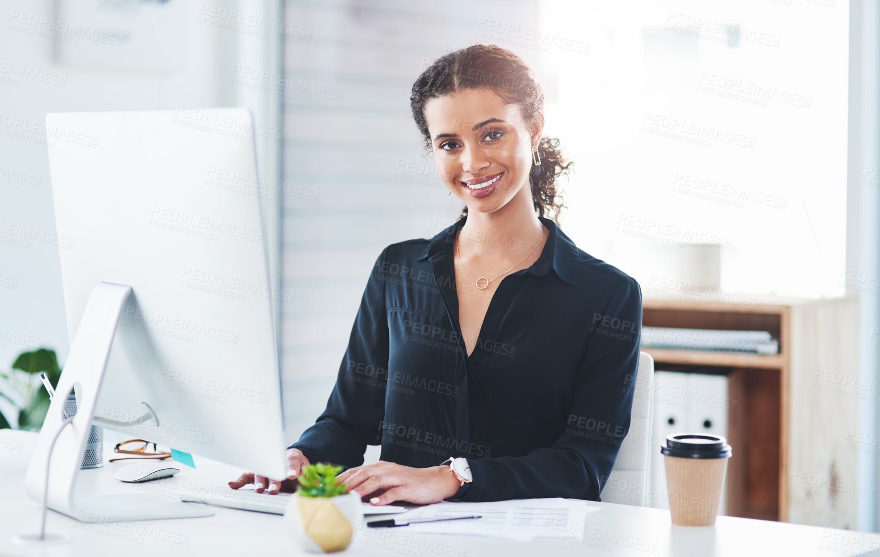 Buy stock photo Portrait of a young businesswoman working in an office