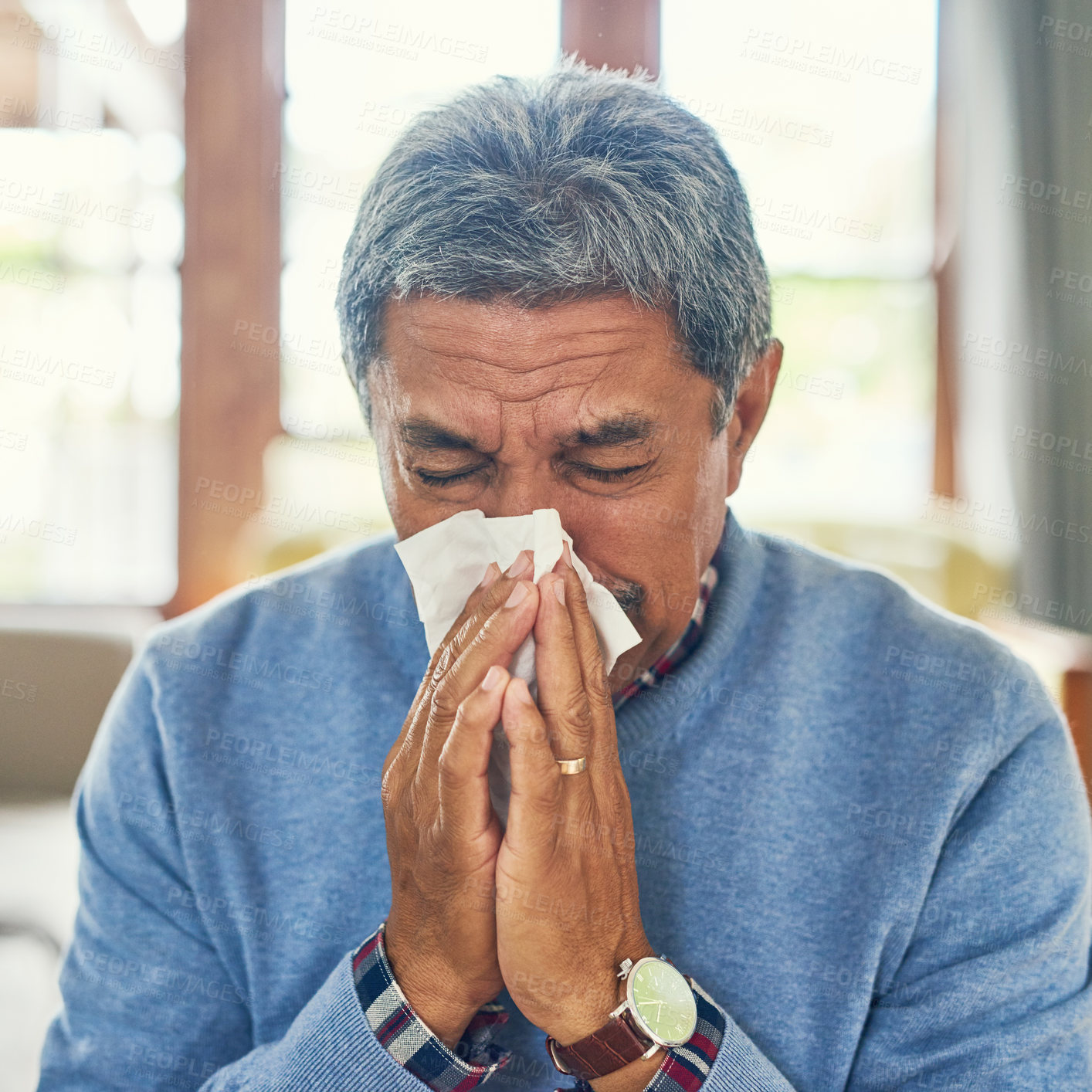 Buy stock photo Senior man, sick and nose blowing in home from virus, allergy and illness with fever Tired, tissue and elderly male person in a house lounge with sneeze from covid and flu with hayfever allergies
