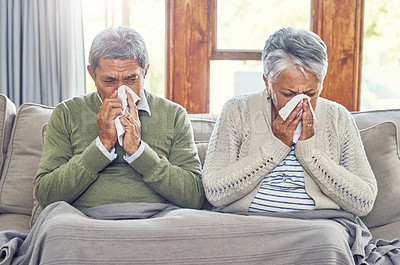 Buy stock photo Senior couple, sick and blowing nose in home from virus, allergy and illness on living room couch. Tired, tissue and elderly people in a house lounge with sneeze from flu and cough on a sofa together