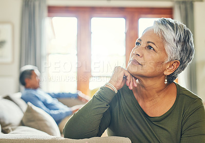 Buy stock photo Mature woman, thinking and calm in home with morning, lounge and relax with man on weekend. Senior lady, memory and nostalgia in living room for wellness, rest or reflection with couple at house