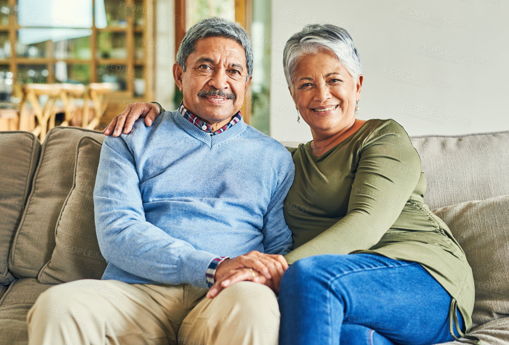 Buy stock photo Portrait of an affectionate senior couple relaxing on a sofa together at home