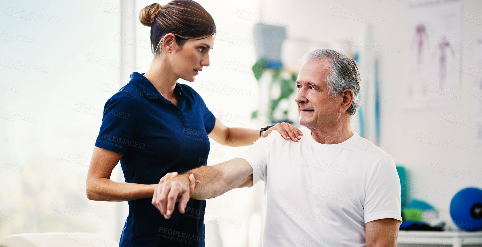 Buy stock photo Physiotherapy doctor, senior patient and stretching arm, physical therapy or orthopedic healthcare in clinic. Physiotherapist, chiropractor and nurse help old man with rehabilitation, muscle and body