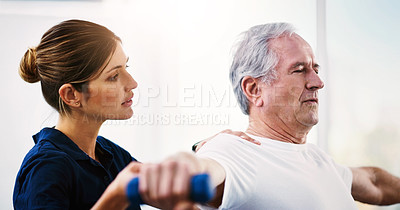 Buy stock photo Physiotherapy, senior patient and dumbbell exercise for rehabilitation, healing or physical therapy in healthcare clinic. Physiotherapist help old man with weights for wellness, osteoporosis and body