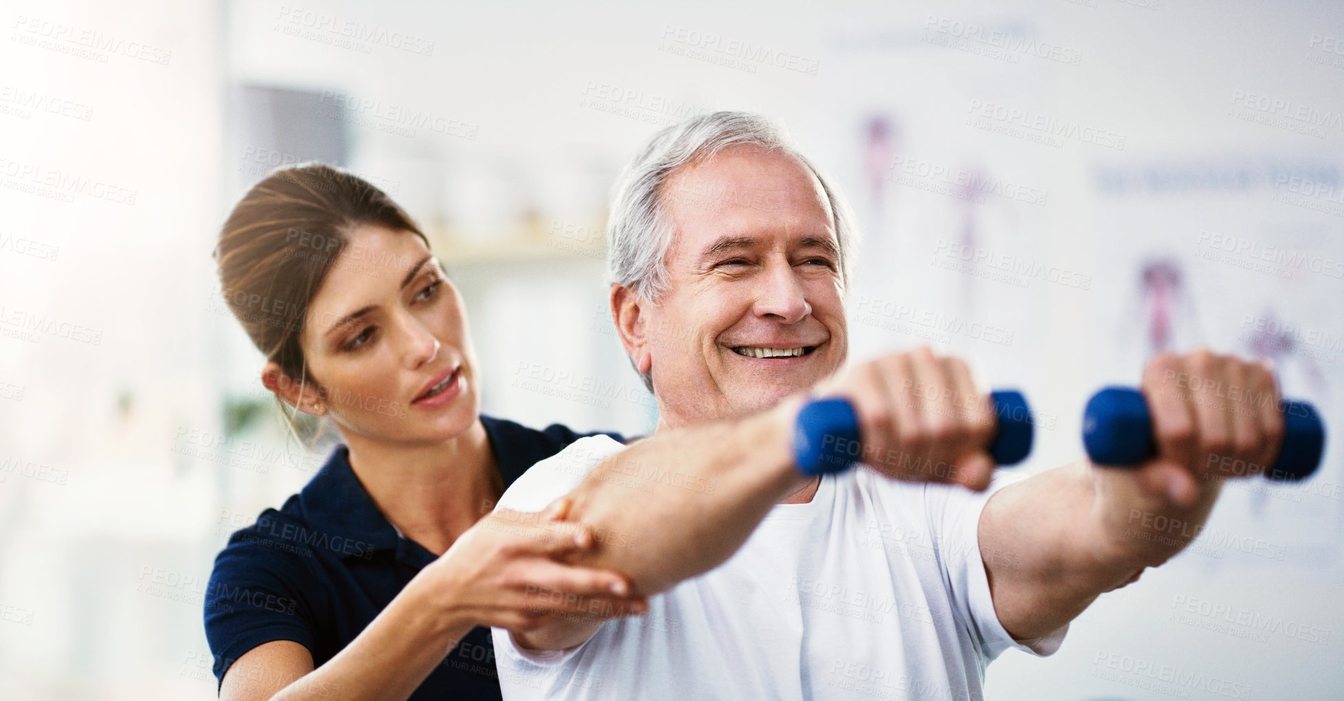Buy stock photo Physiotherapy, senior man and dumbbell exercise, injury rehabilitation or workout at health clinic. Happy elderly patient, woman physiotherapist or muscle training for strong body, care or fitness
